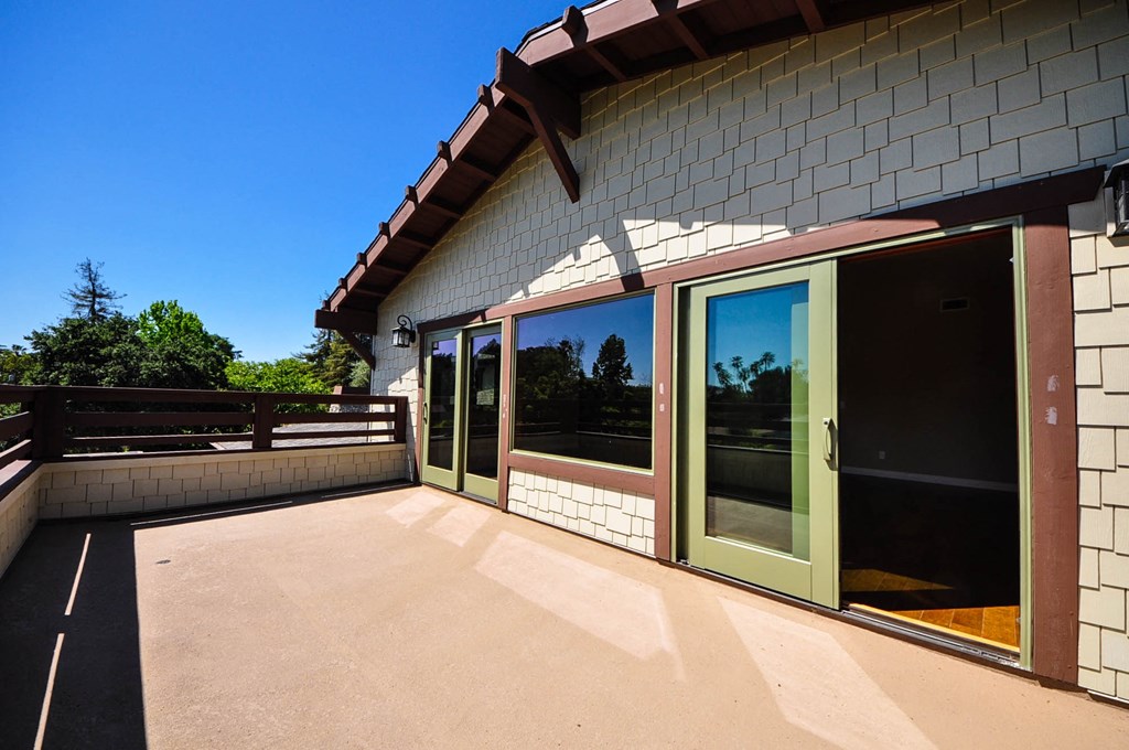 A house with a brown roof and a green door.