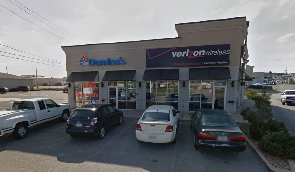 A Domino's Pizza store with a Verizon On Wireless store in the front.