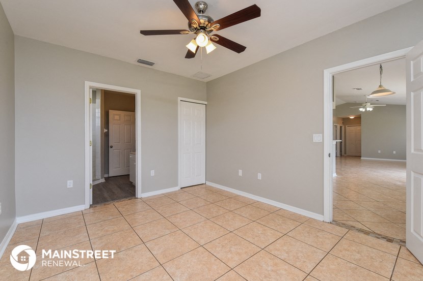 the living room and dining room are open to the hallway and kitchen