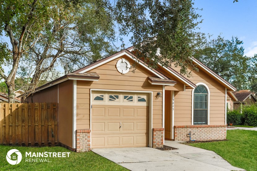 the front of a house with a garage door
