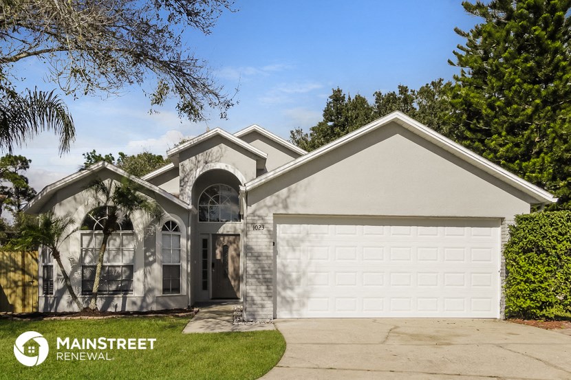 a house with a garage and a white garage door