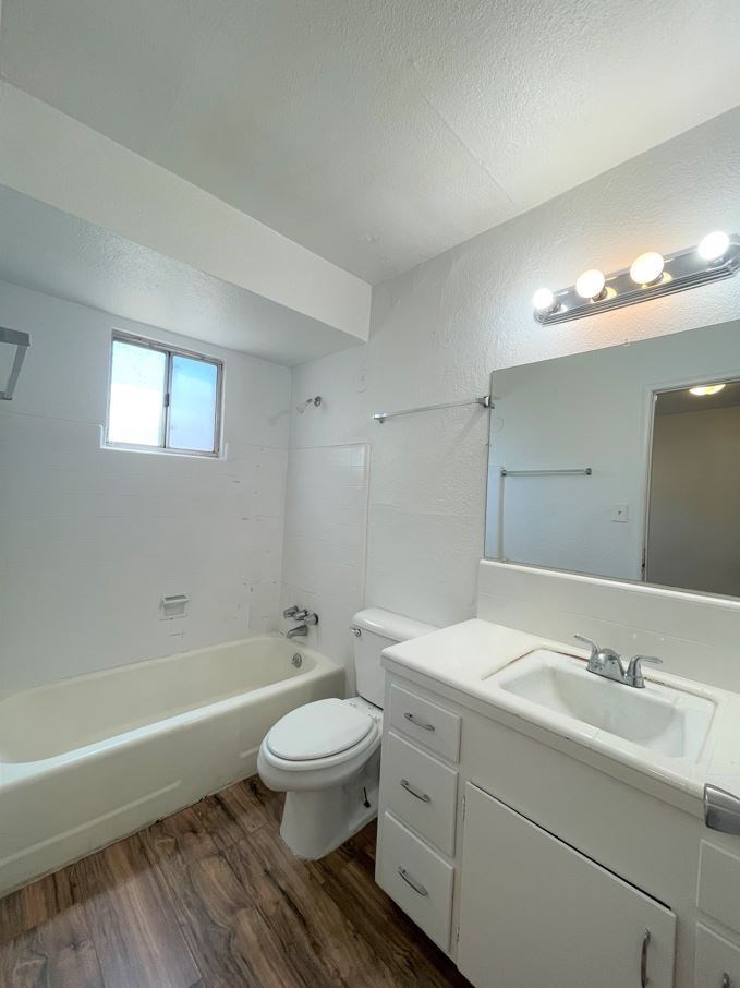 a bathroom with a sink toilet and a bath tub