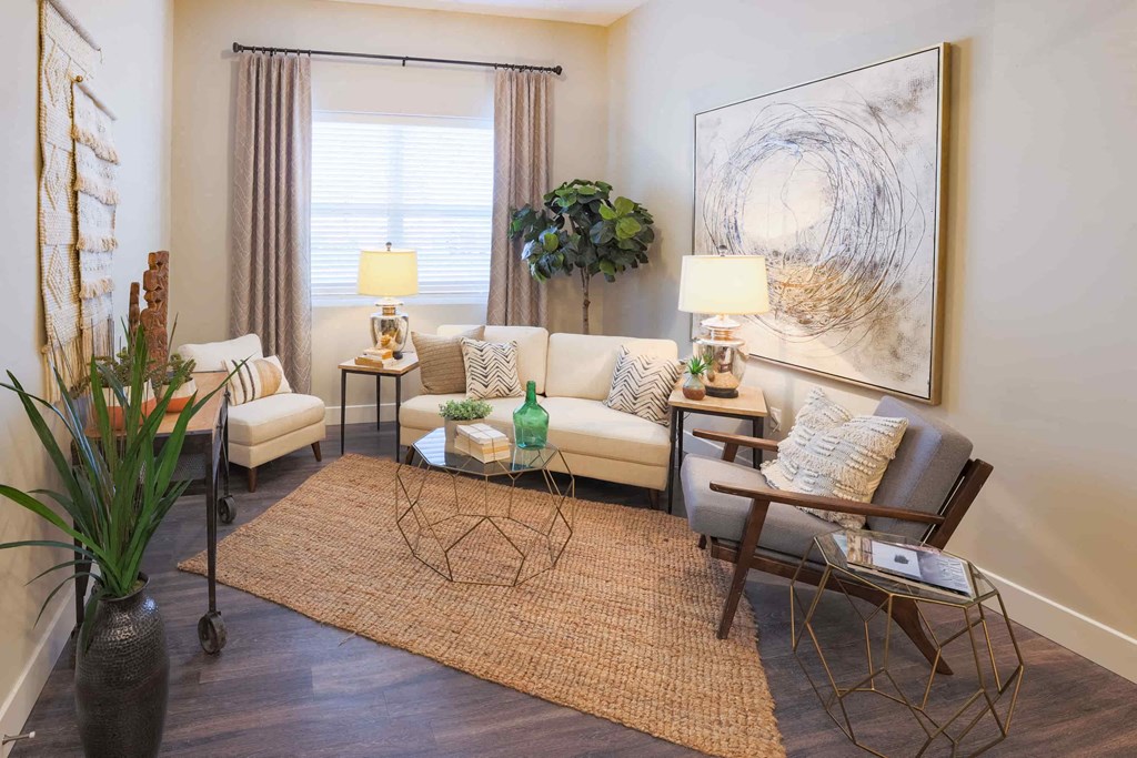 a living room filled with furniture and a rug