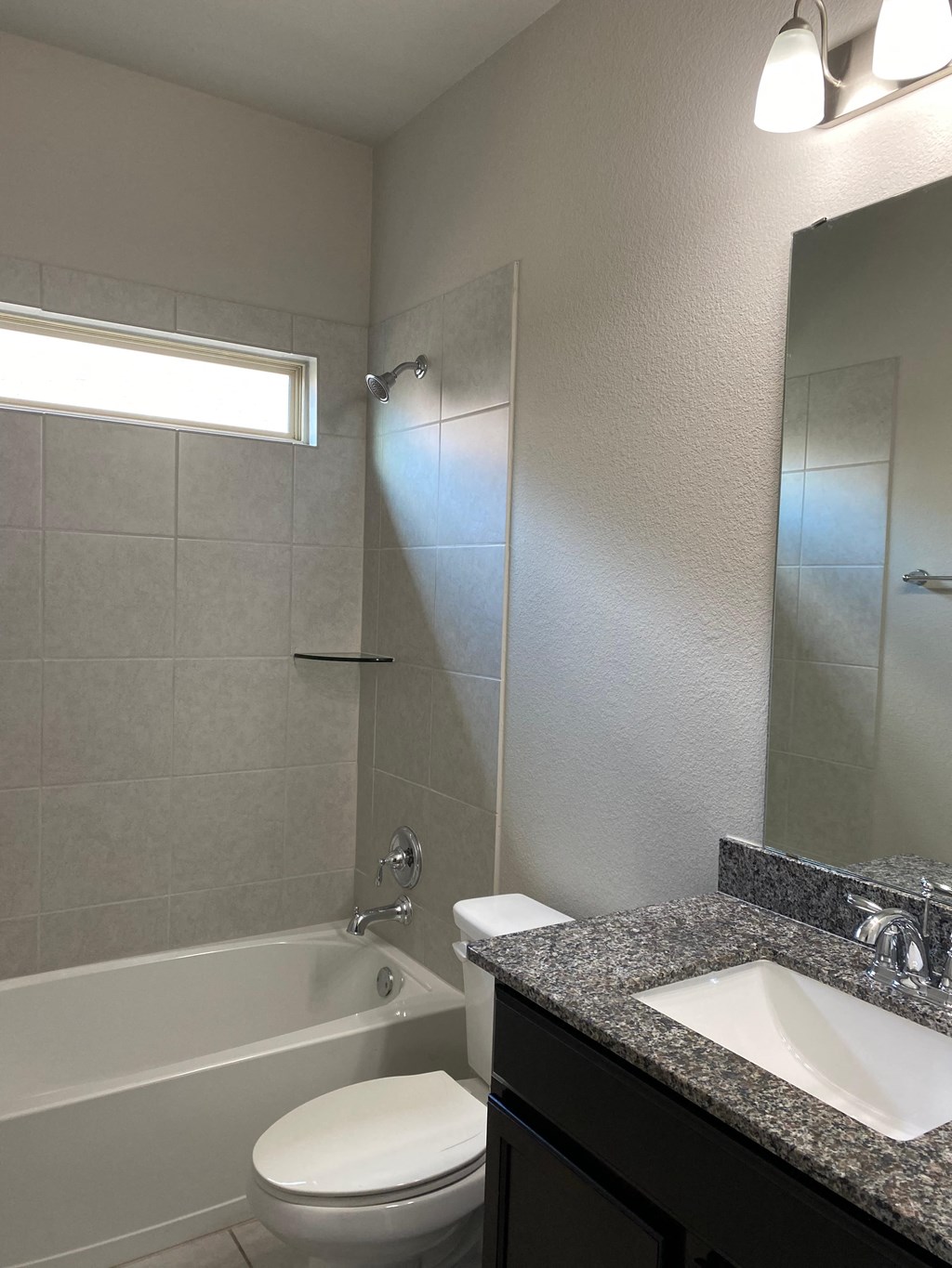 a bathroom with a sink toilet and a shower