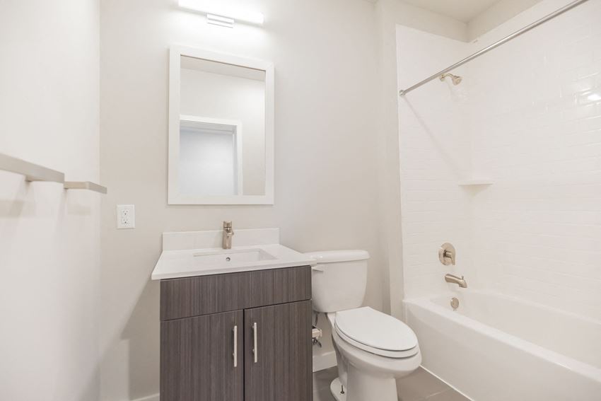 a bathroom with a sink toilet and a shower