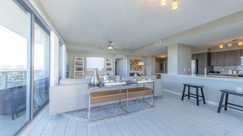 A modern kitchen with a dining table and chairs.