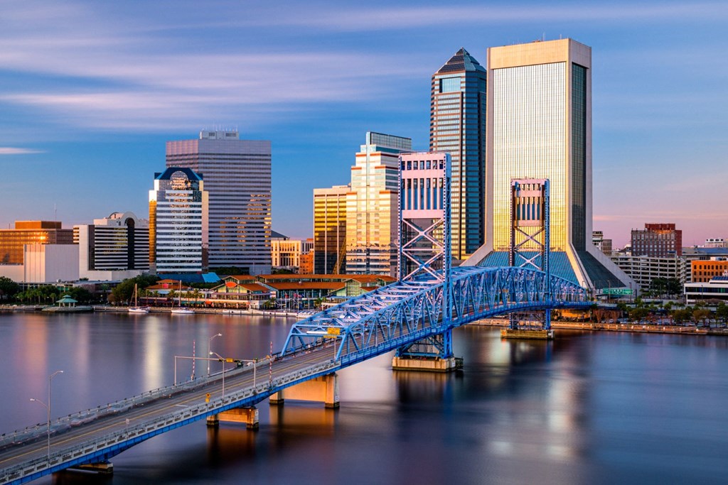 a view of the city with a blue bridge over the river