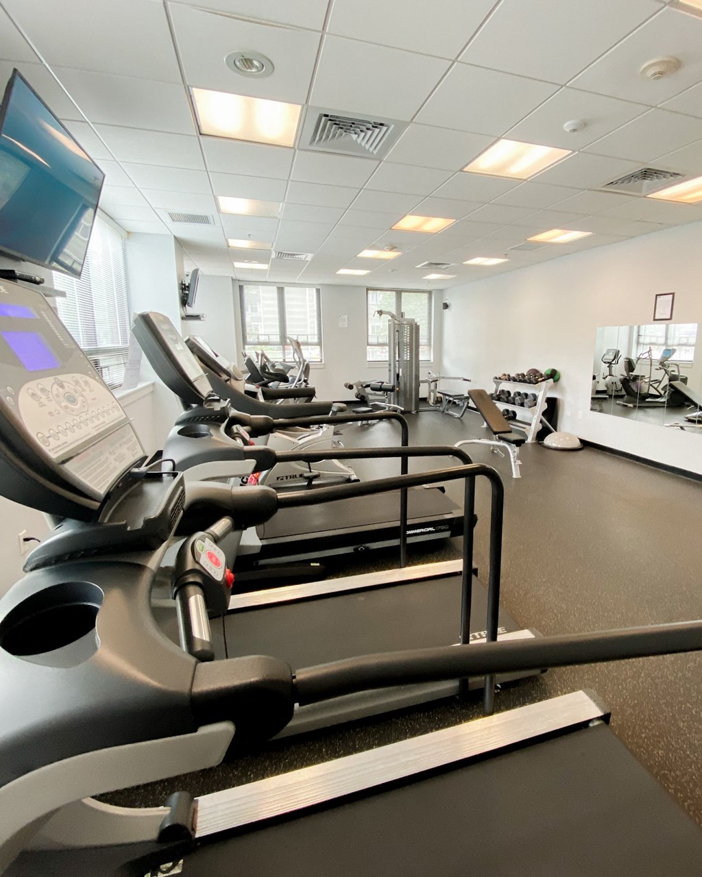 a gym with various pieces of exercise equipment