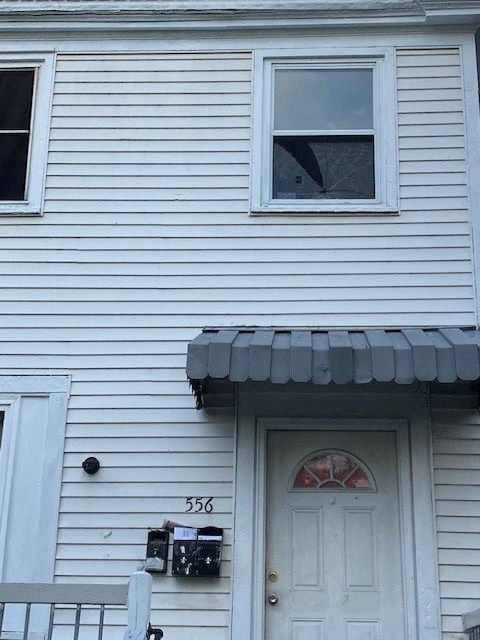 a white house with a white door and a window