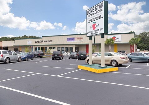 A parking lot in front of Lone Star High School.