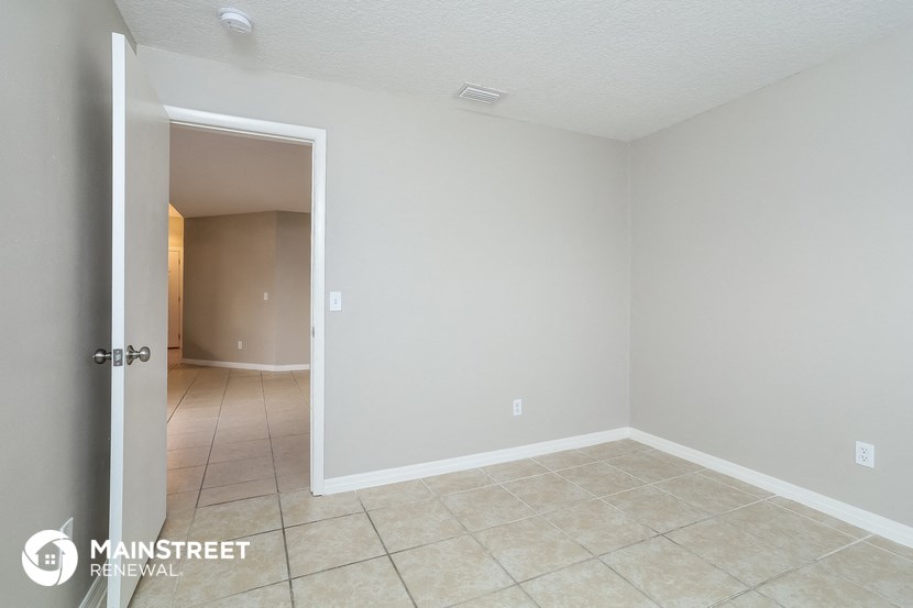 the living room and dining room of an apartment