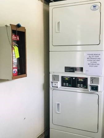 a white refrigerator and a white oven in a room