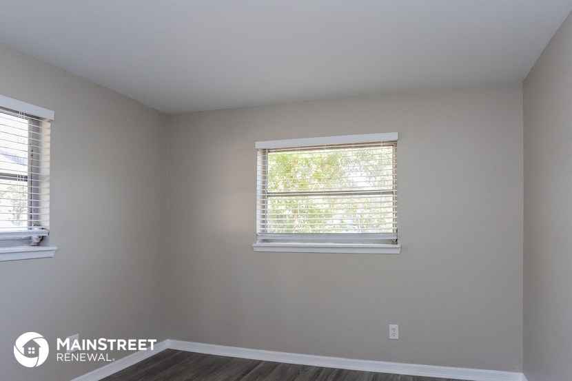 the living room of a new home with two windows