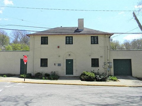 a white building with a stop sign in front of it