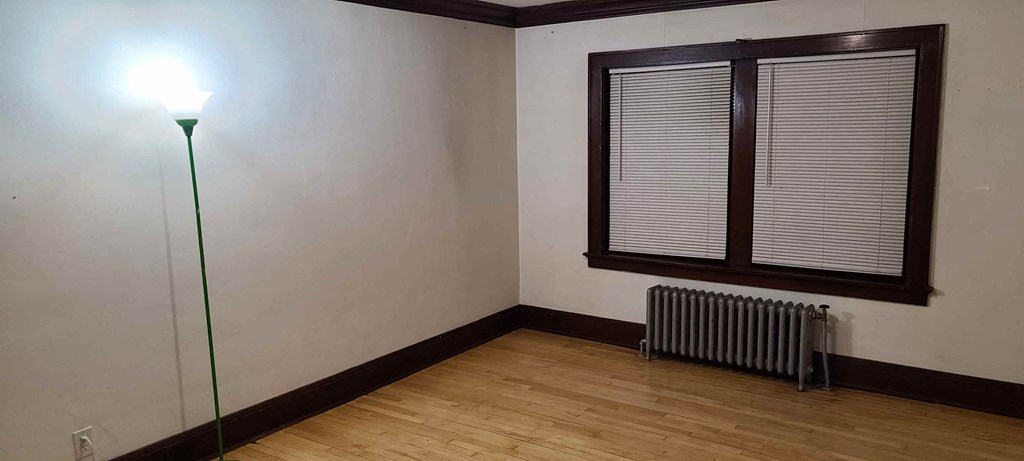 a room with a radiator and a window