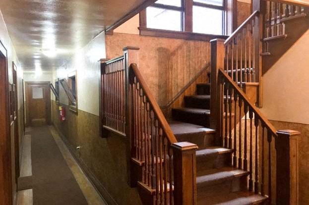 a set of wooden stairs in a building