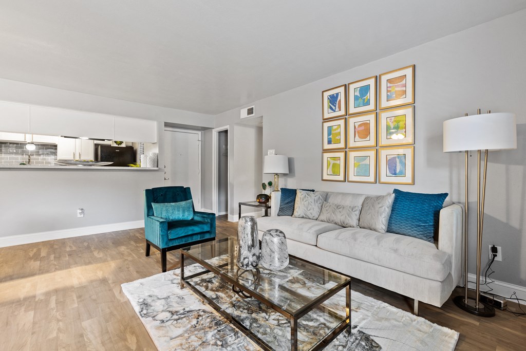 a living room with a couch and a glass coffee table