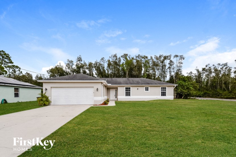 A house with a garage is for sale.