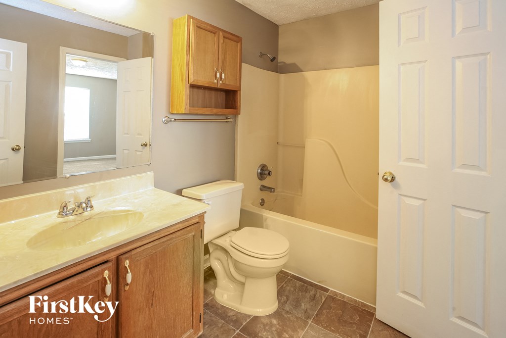 a bathroom with a toilet and a sink