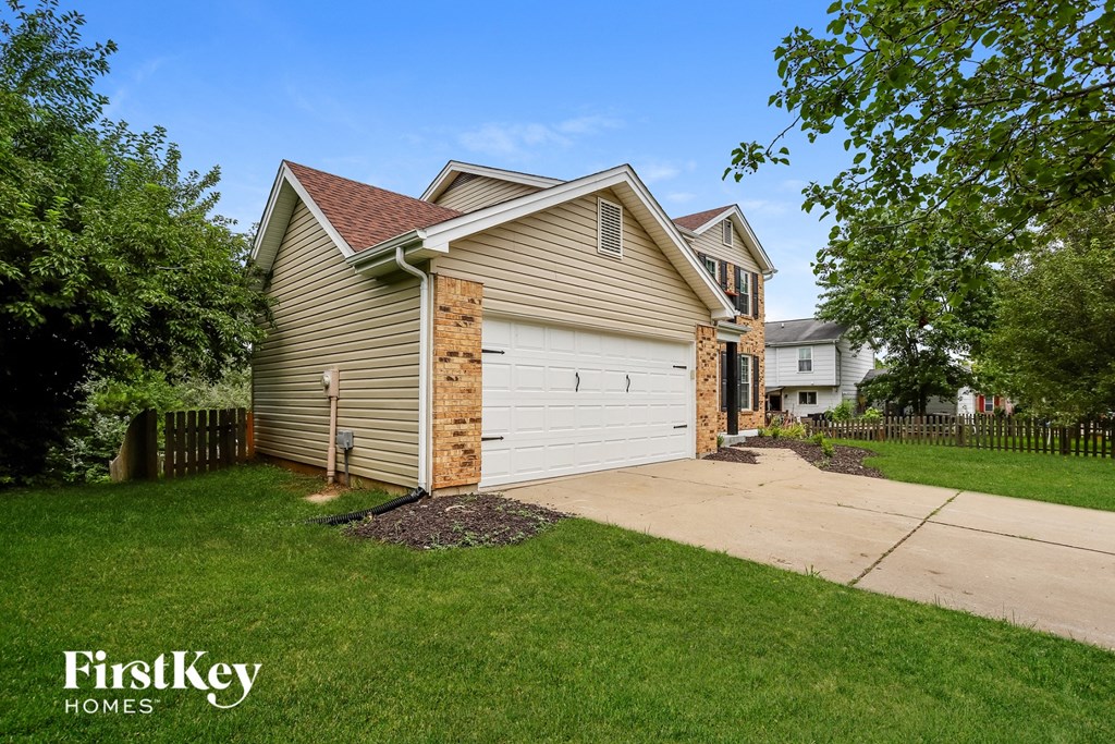 A house with a garage is for sale by FirstKey Homes.
