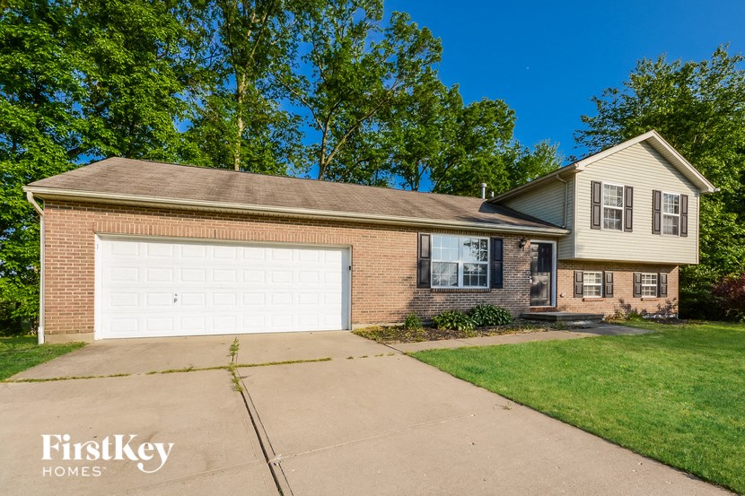 a brick house with a white garage door