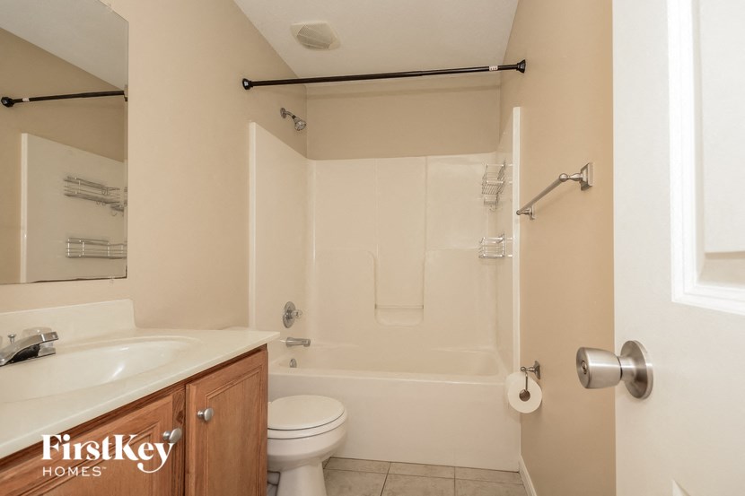 a bathroom with a sink toilet and a shower