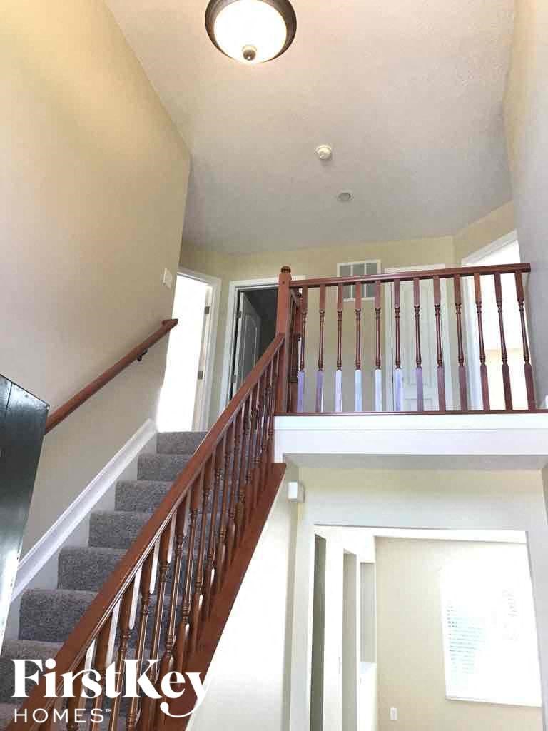 a view of a staircase in a home from the top of it