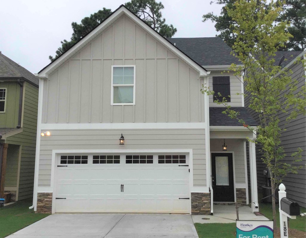 A two-car garage is attached to a house.