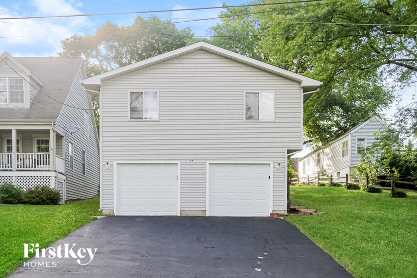 a white house with a white garage door