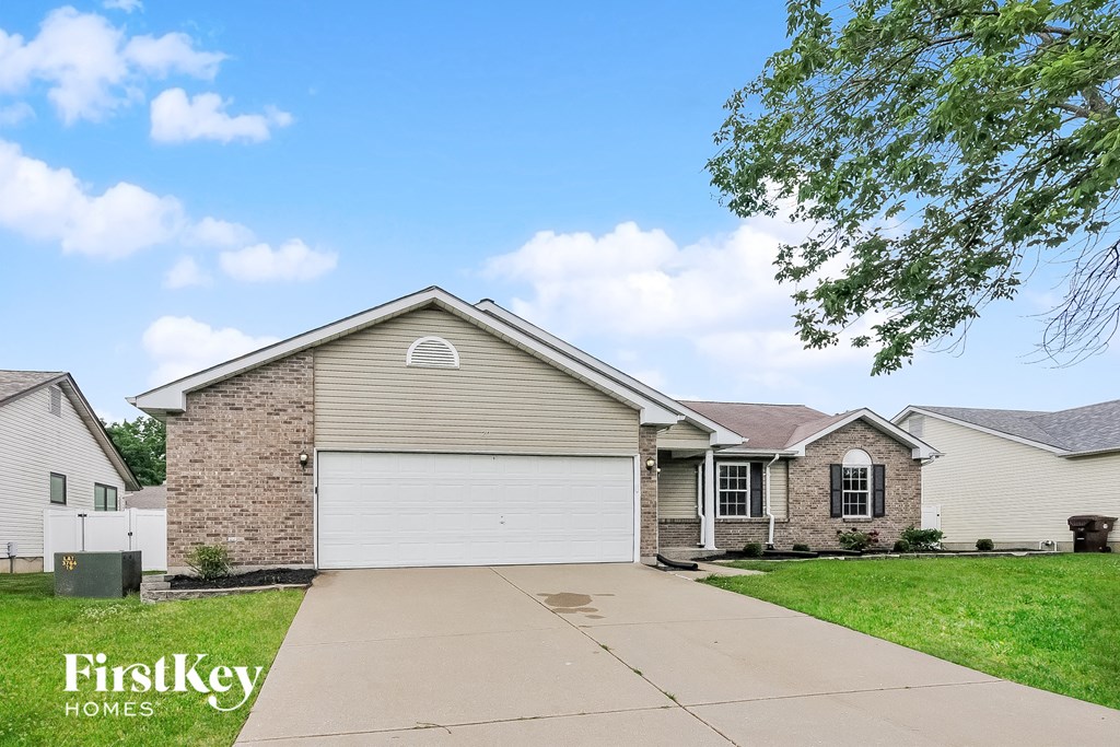 a brick house with a white garage door