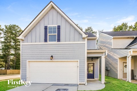 a gray and with a white garage door