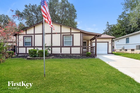 a home with an flag in front of it