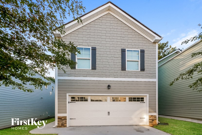 a white house with a white garage door