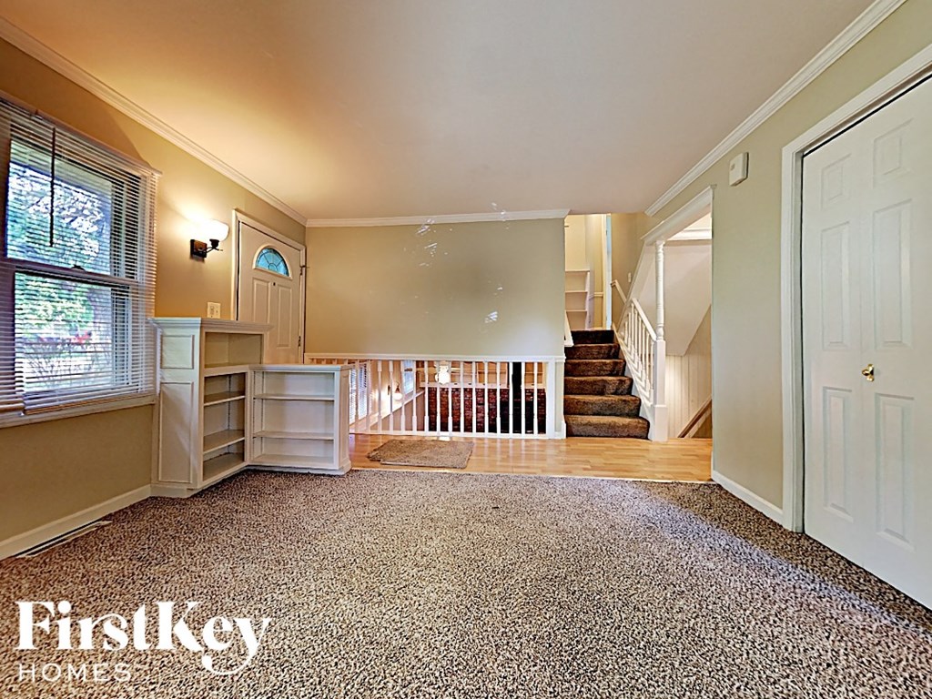 a fisheye view of a living room with a staircase in the background