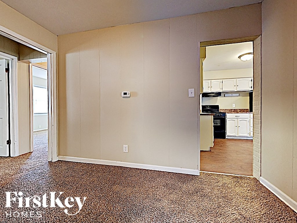 a view of the kitchen and living room from the dining room