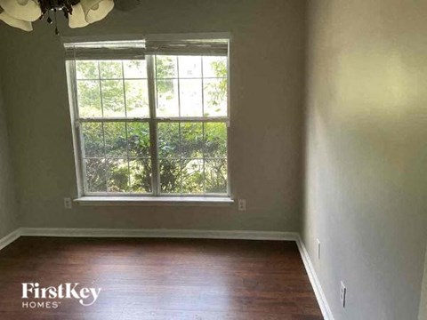 A room with a FirstKey Homes logo on the floor.