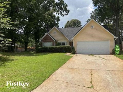 A house with a driveway in front of it.