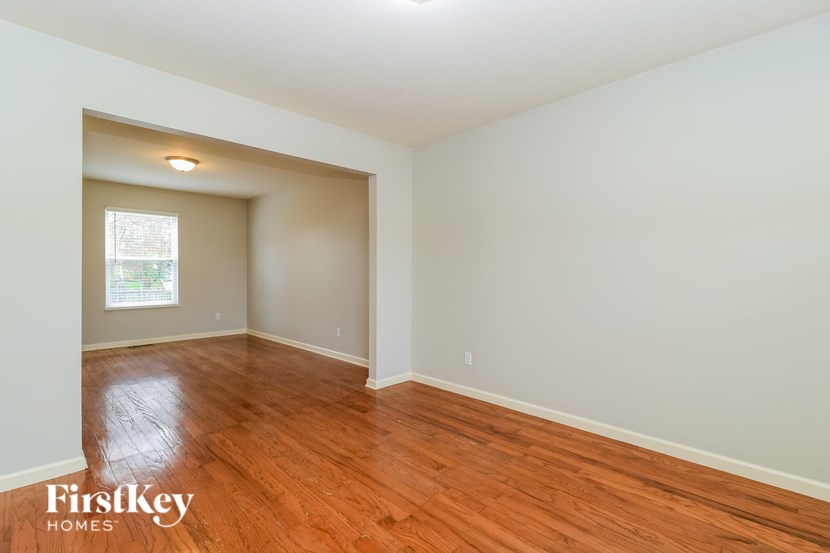 A room with wooden floors and a window.