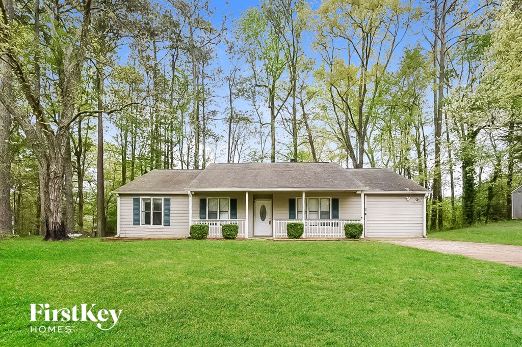 A house with a lawn in front of it.