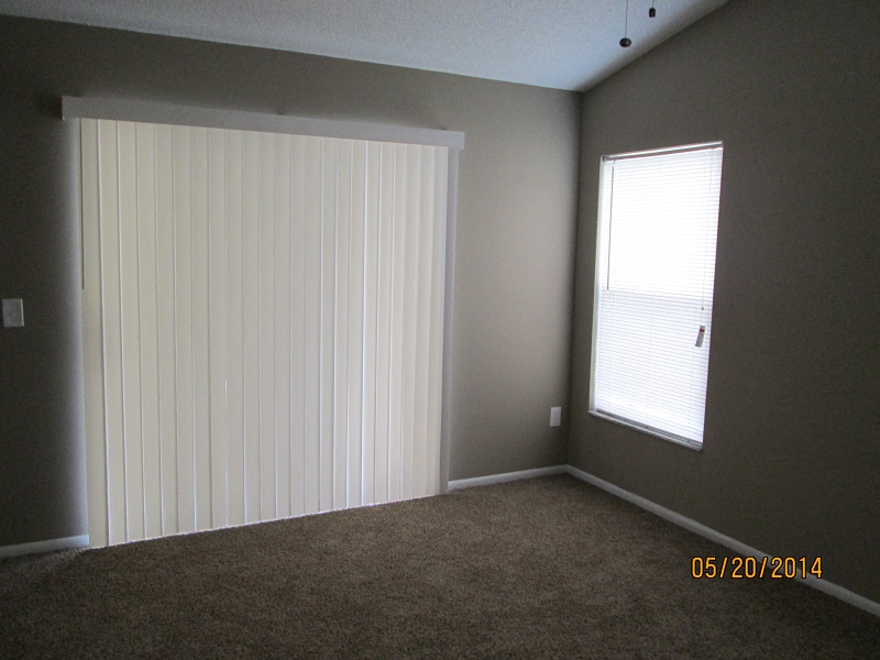 full 360 view of a room with white blinds and a window