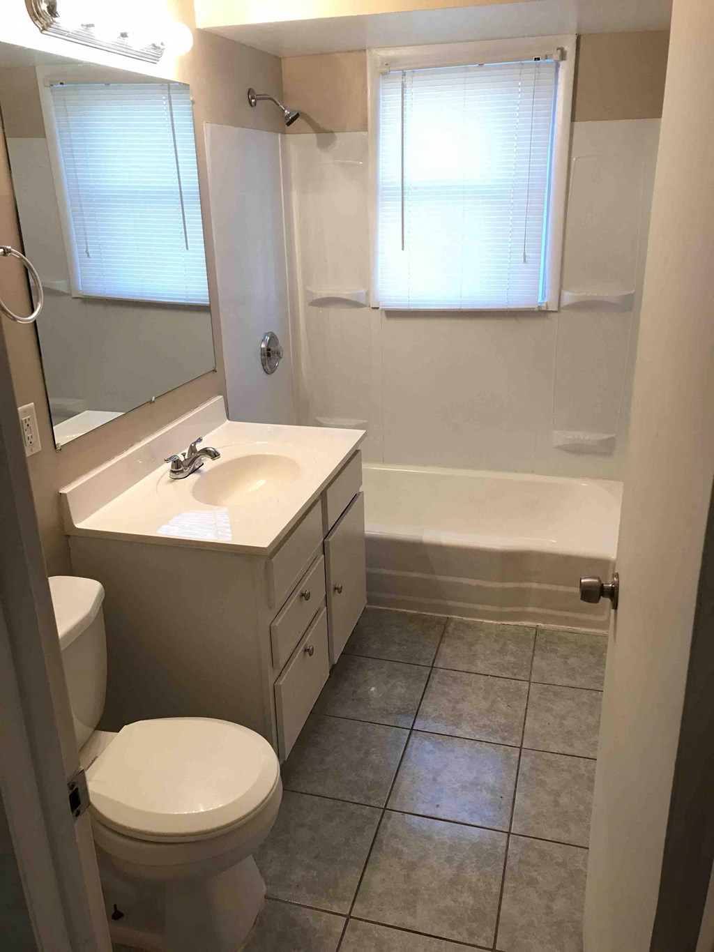 a bathroom with a sink toilet and a bath tub