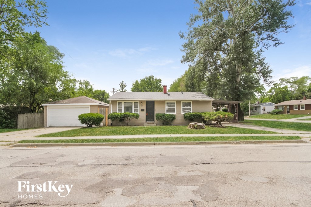 A house with a driveway in front of it.