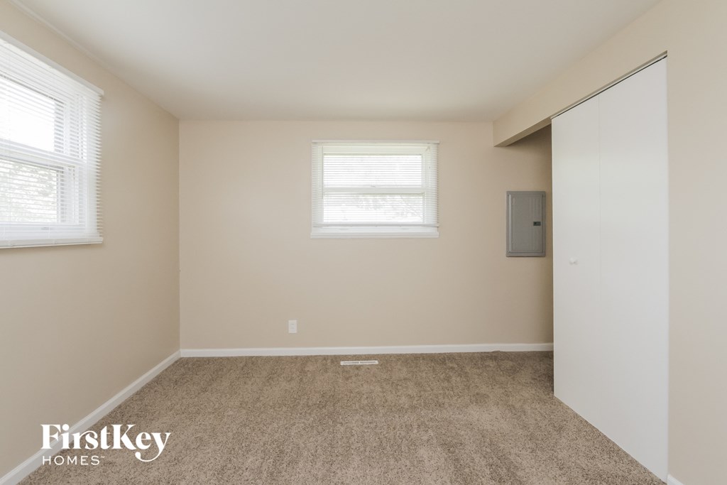 A room with a window and a door is shown.