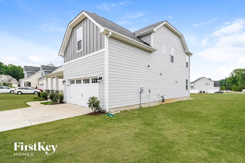 A house with a garage is for sale by FirstKey Homes.