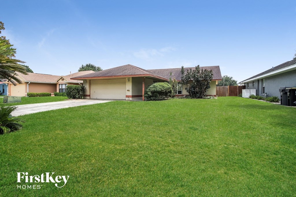A house with a lawn in front of it.