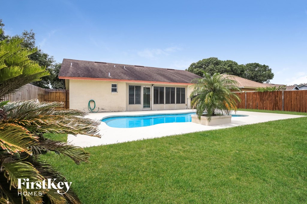 A house with a pool in the backyard.