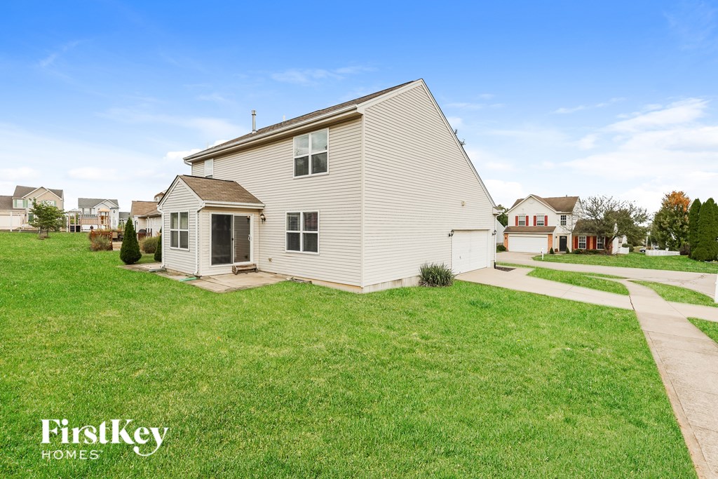 A house with a lawn in front of it.