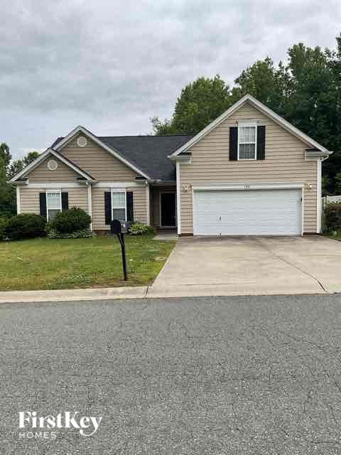 A house with a garage and a sign that says FirstKey Homes.