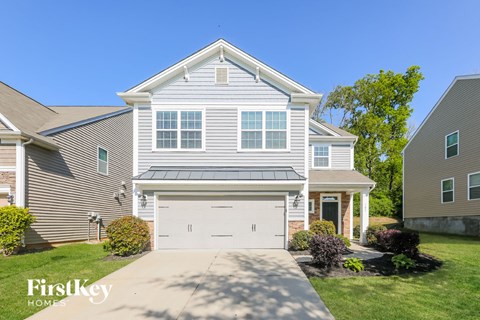 a white house with a white garage door