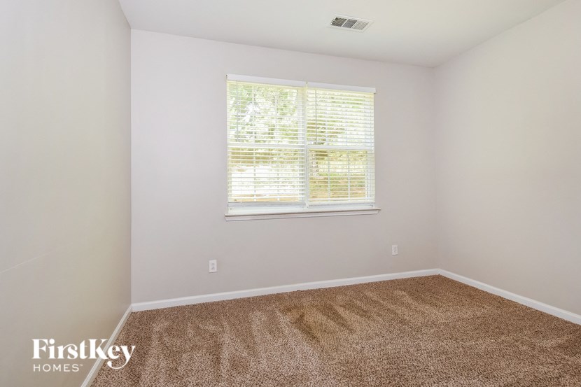 a room with carpet and a window